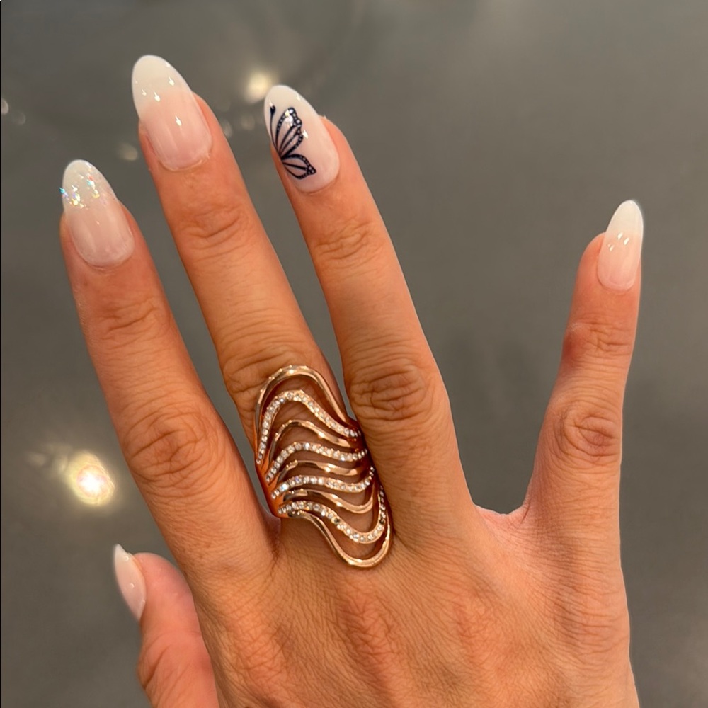 Elegant Gold Wave Ring with Crystals